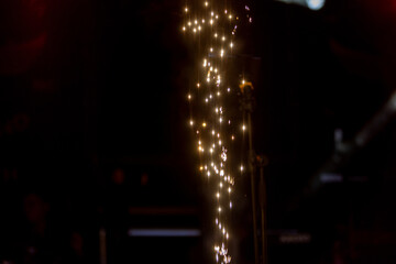 An Exciting Event Featuring Sparkling Light Trails at Night with Vibrant Colors and Atmosphere