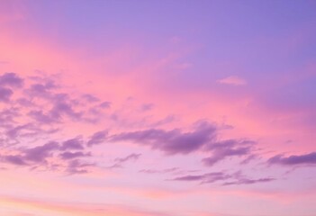 Obraz premium Soft violet and pastel hues paint a tranquil evening sky, clouds softly brushed with color, peaceful, violet