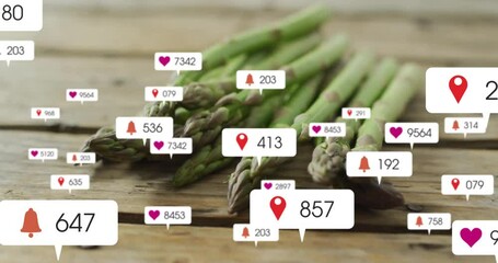 Opening asparagus on tabletop starting icons swirling then fading, highlighting social engagement - Powered by Adobe