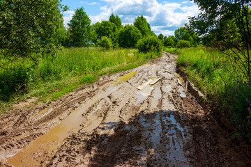 Very dirty country road, muddy after rain