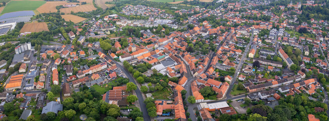 Aerial view around the old town in the city  Königslutter am Elm, on an cloudy spring noon