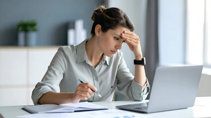 Woman stressed at desk - Powered by Adobe