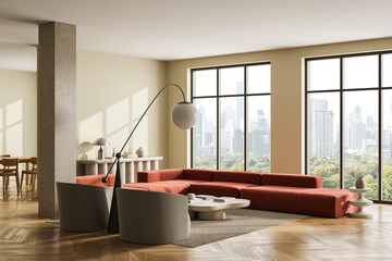 Modern living room interior with large red sectional sofa, cozy decor, and panoramic city view...