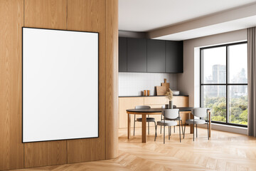 Blank vertical poster mockup on wooden wall in bright modern kitchen interior with panoramic city...
