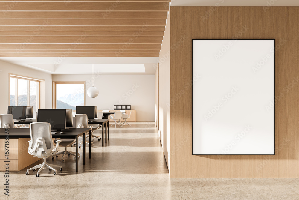 Poster modern office interior with blank vertical poster mockup on wooden wall and rows of workstations wit