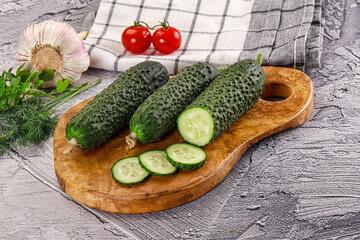 Raw green cucumbers with slices