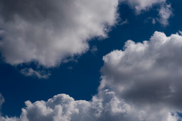 beautiful picture of clouds, a path of blue sky between clouds, a symbol of aspiration and moving forward