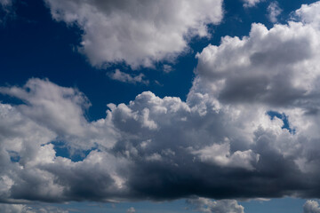 beautiful picture of clouds, a path of blue sky between clouds, a symbol of aspiration and moving...