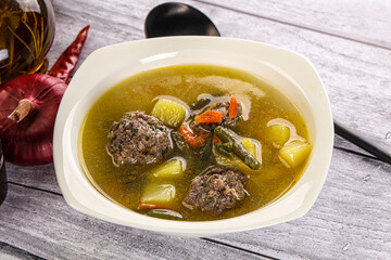 Soup with beef meatballs and vegetables