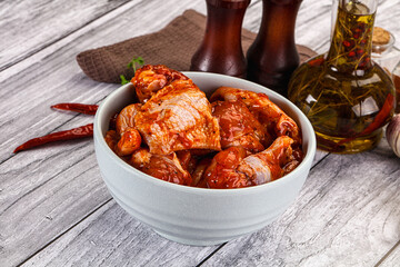 Raw marinated buffalo chicken wings