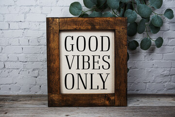 Good Vibe Only Motivational and Inspirational quotes on wooen background