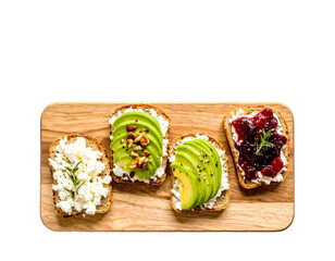 Variety of Toasts with Avocado, Jam, Nuts, and Cheese on Wooden Board Isolated on Transparent Background