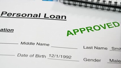 Reviewing the personal loan approval letter.