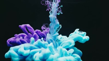 Abstract image of colorful ink plumes swirling and mixing in water against a dark background. - Powered by Adobe
