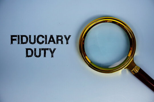 Fiduciary Duty text with magnifying glass on blue background