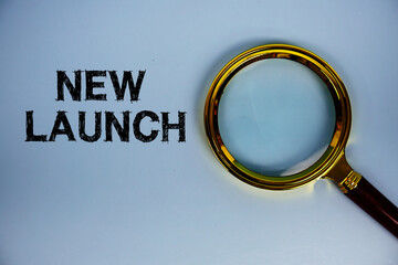 New Launch text with magnifying glass on blue background