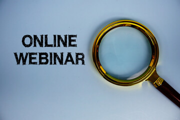 Online Webinar text with magnifying glass on blue background