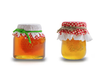 Honey in a glass jar isolated on white background. This has clipping path.
