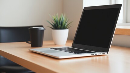 Fototapeta premium Laptop on a desk, coffee, plant
