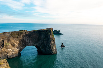 A vast black sand beach stretching endlessly, shaped by volcanic activity and roaring Atlantic...