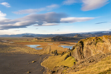 A vast black sand beach stretching endlessly, shaped by volcanic activity and roaring Atlantic...