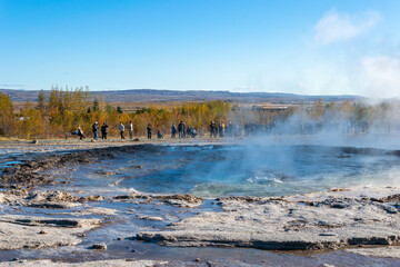 Strokkur erupts every few minutes near the original Geysir, sending boiling water high into the...