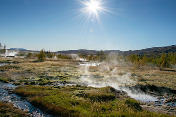 Strokkur erupts every few minutes near the original Geysir, sending boiling water high into the...