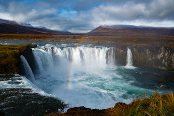 Fototapeta premium Godafoss, the “Waterfall of the Gods,” is a wide, elegant waterfall in North Iceland, rich in history and natural beauty.