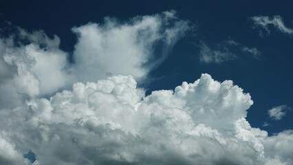 The sky and clouds during the day. Clouds gather all over the sky.