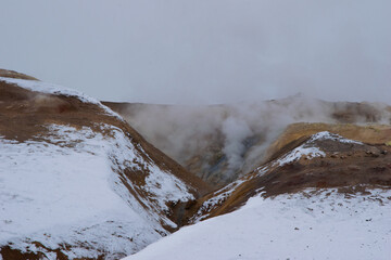 Hverir is a geothermal field in North Iceland, filled with bubbling mud pools, steaming fumaroles,...