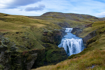 Skógafoss is a mighty waterfall, often seen with rainbows. Follow the trail above to discover many...