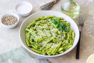 Pasta casarecce with pesto sauce, basil and cheese. Italian cuisine. Vegetarian food.