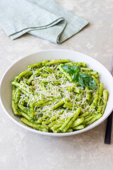 Pasta casarecce with pesto sauce, basil and cheese. Italian cuisine. Vegetarian food.