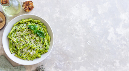 Pasta casarecce with pesto sauce, basil and cheese. Italian cuisine. Vegetarian food.