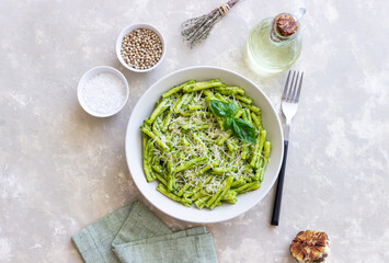 Pasta casarecce with pesto sauce, basil and cheese. Italian cuisine. Vegetarian food.