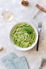 Pasta casarecce with pesto sauce, basil and cheese. Italian cuisine. Vegetarian food.