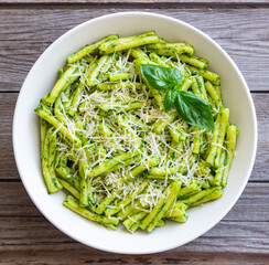 Pasta casarecce with pesto sauce, basil and cheese. Italian cuisine. Vegetarian food.