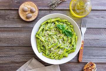 Pasta casarecce with pesto sauce, basil and cheese. Italian cuisine. Vegetarian food.