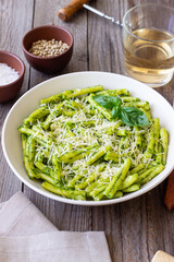 Pasta casarecce with pesto sauce, basil and cheese. Italian cuisine. Vegetarian food.