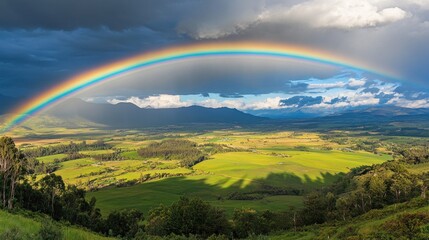 Fototapeta premium Rainbow over a valley