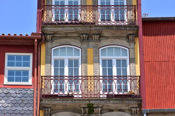 Multi-storey town house with balconies and white multi-pane French doors. Location: Porto Portugal