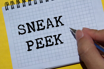 Sneak peek message written on notebook page on yellow background. Conceptual sneak peek symbol....