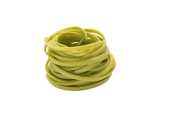 a stack of pasta noodles on a white surface