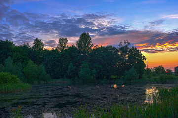 Picturesque sunrise over the lake. Impressive photo wallpaper. Discover the beauty of the earth. HDR style.