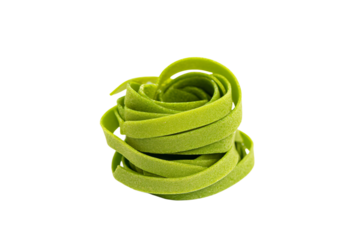 a pile of green pasta noodles on a white surface
