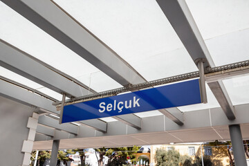 Selcuk train station platform sign under canopy roof in Izmir province, Turkey