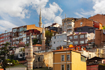 Colorful hillside buildings and historic mosque minarets in Balat district of Istanbul, Turkey