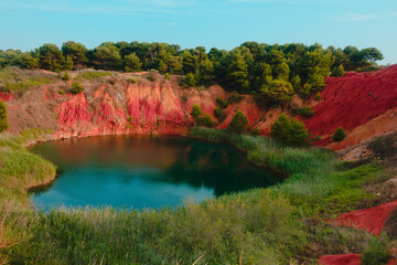 Vibrant colors landscape in the quarry of bauxite near Otranto, Salento, Apulia Region, Italy