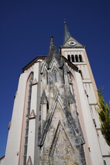 The Radstadt Parish Church stands alongside the northern city wall in the town of Radstadt in the...