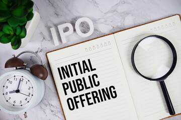 IPO - Initial Public Offering acronym on notepad, Business concept background
